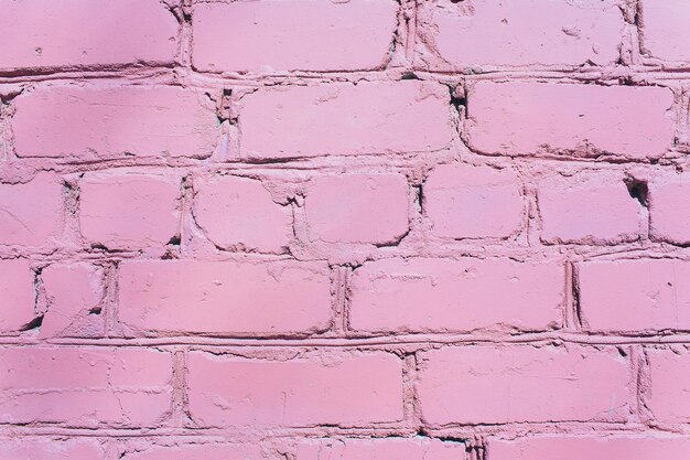 Mooie roze paarse bakstenen muur met witte grout kleurrijke achtergrond abstracte textuur voor kopieerruimte