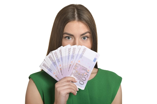 Mooie vrouw met geld op witte achtergrond.