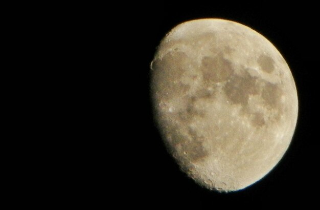 Moon over black background