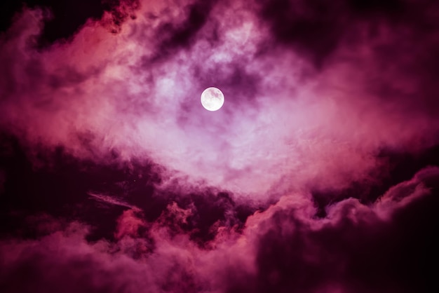 The moon on the dark sky among the clouds natural abstract background