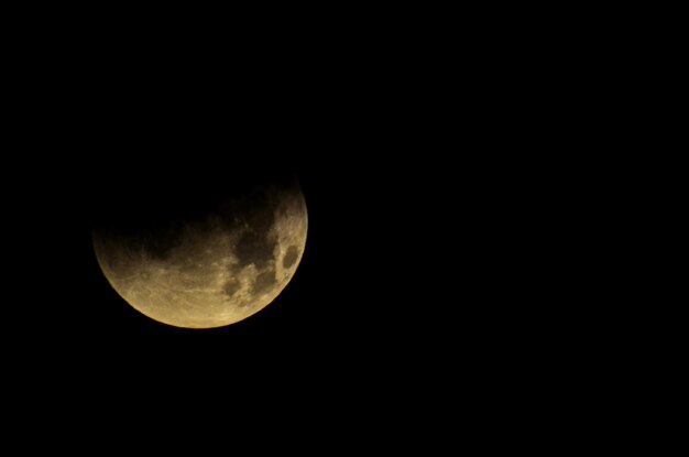 Photo moon eclipse closeup showing the details of lunar surface.