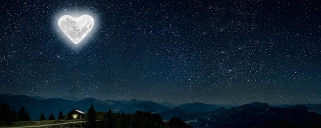 The moon heartshaped shines over the lovers' house on valentine's day