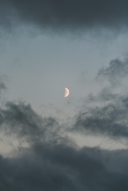 The moon in the sky is a clear blue color.