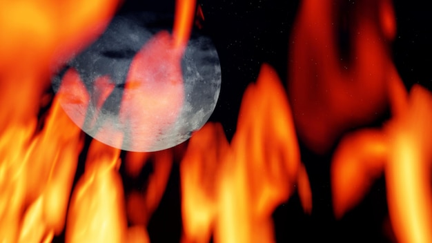 Photo moon through the flame of fire