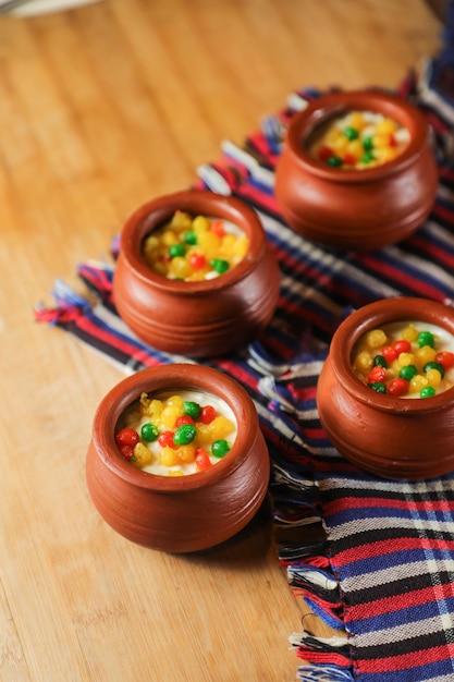 Moondi rabri milk kheer served in pot isolated on mat top view of indian bangali and pakistani dessert mithai