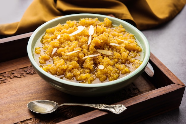 Moong dal halwa is a classic Indian sweet dish made with moong lentils, sugar, ghee and cardamom powder