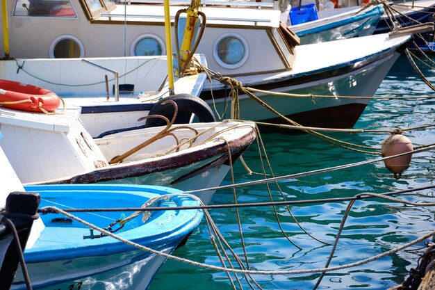 Moored boats at marina in the sunny afternoon