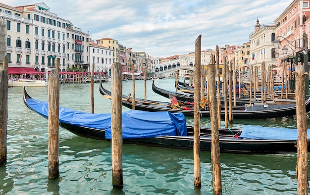 Moored gondolas on the Grand Canal in Venice, Italy. Venetian urban view