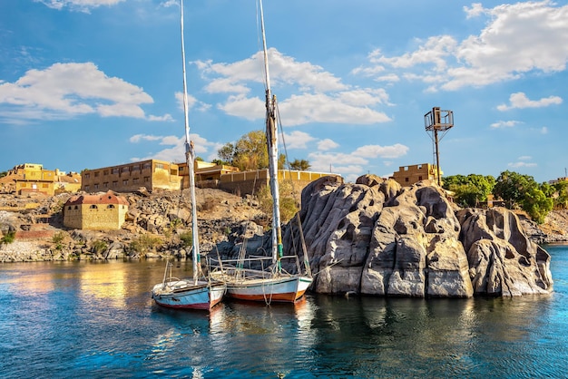 Moored sailboats on river Nile in Aswan at summer day