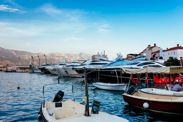 Photo the moored yachts stand on an anchor