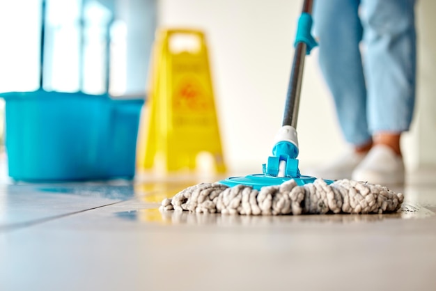 Mop cleaner and washing wet floor for hygiene disinfection or sanitary area for cleanliness at the workplace Housekeeper cleaning dirty flooring for sanitization water or wash indoors