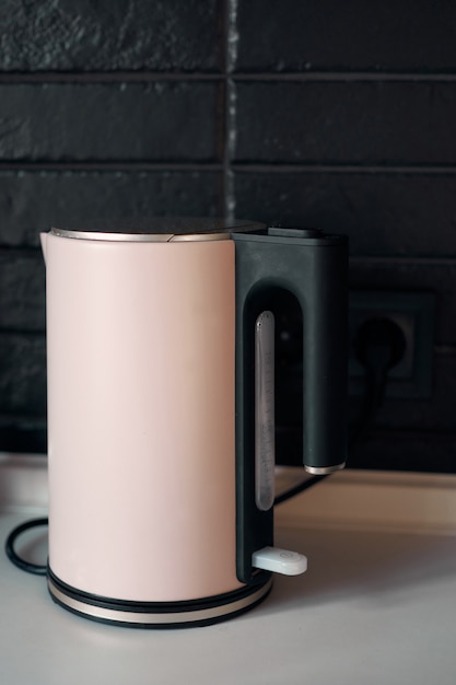 Photo morden kitchen opened drawer full of kitchenware. minimalist interior design. stylish kitchen. black brick wall in a designer minimalist room interior of an architect. scandinavian style.