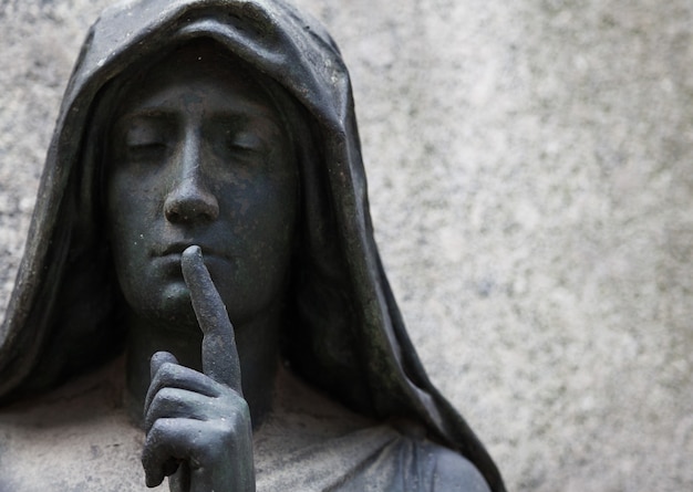 More than 100 years old statue. Cemetery located in North Italy.