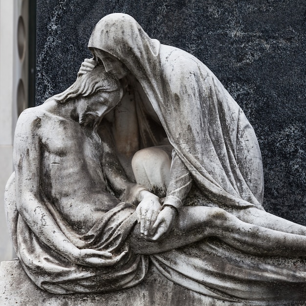 Photo more than 100 years old statue. cemetery located in north italy.