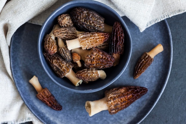 Morel mushrooms in a blue bowl