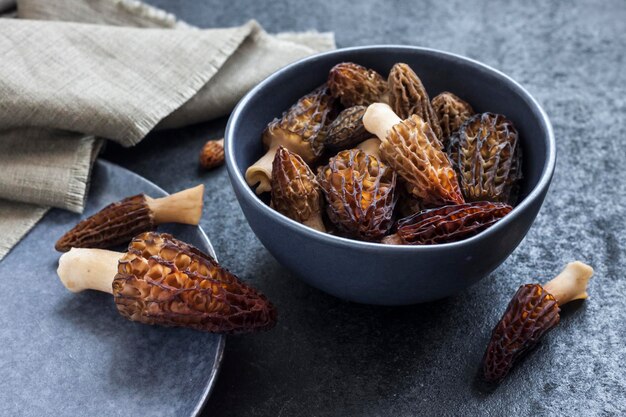 Morel mushrooms in a blue bowl