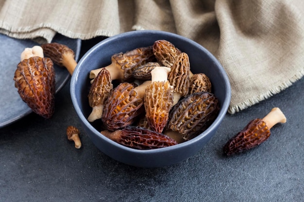 Morel mushrooms in a blue bowl