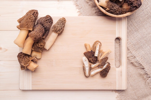 Morel mushrooms on a cutting board top view