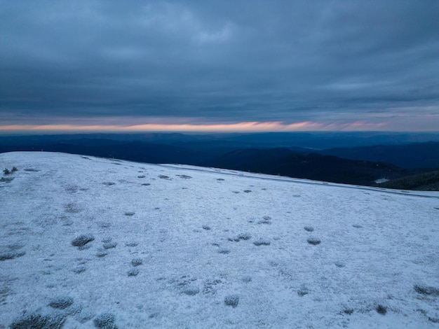 Morning aerial view of snow covered Balkan Mountains in Beklemeto pass region