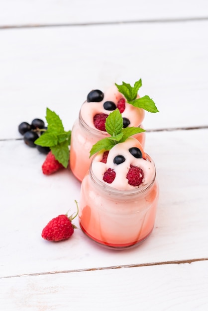 Morning berry pudding with berries and mint leaf.