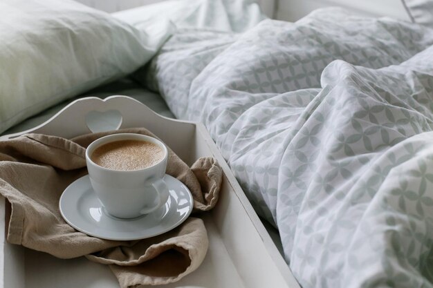 Morning coffee aside the bed