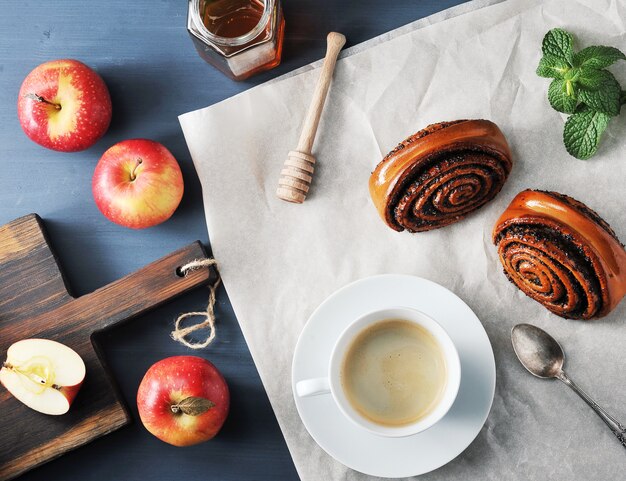 Morning coffee - coffee and bread rolls with poppy seeds, apples and honey