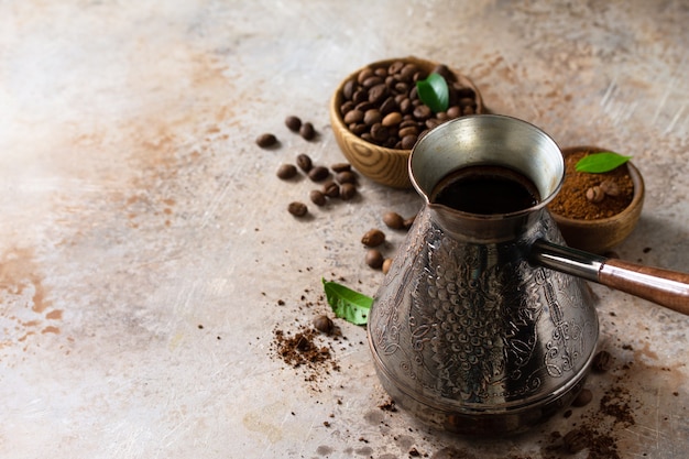 Morning coffee concept Turkish coffee in Turk and coffee beans Copy space