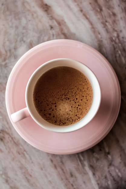 Morning coffee cup with milk on marble stone flat lay hot drink
on table flatlay top view food photography and recipe inspiration
for cooking blog or cookbook