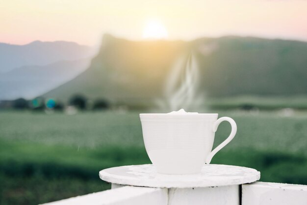 Morning coffee on the table mountains background