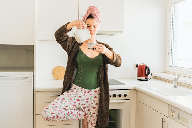 Morning coffee in yoga pose at home of teenage girl