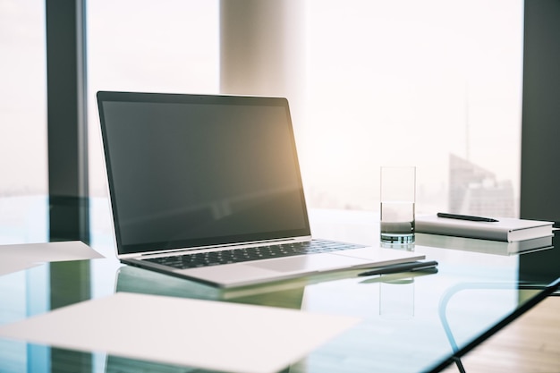 Morning desktop with laptop and a window with a city view Mockup 3D Rendering