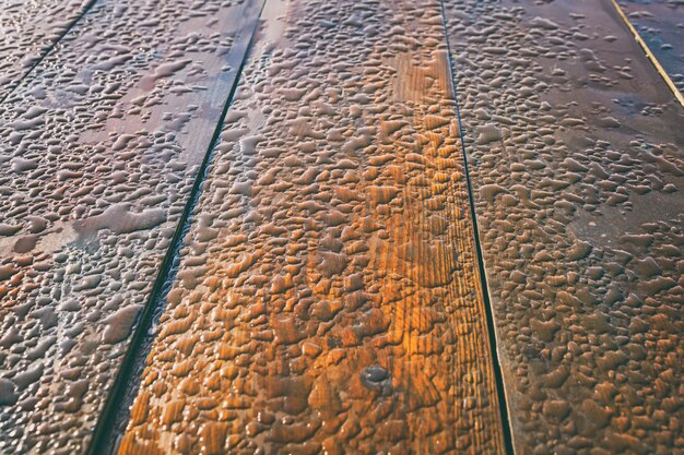 Morning dewdrops on a wooden table