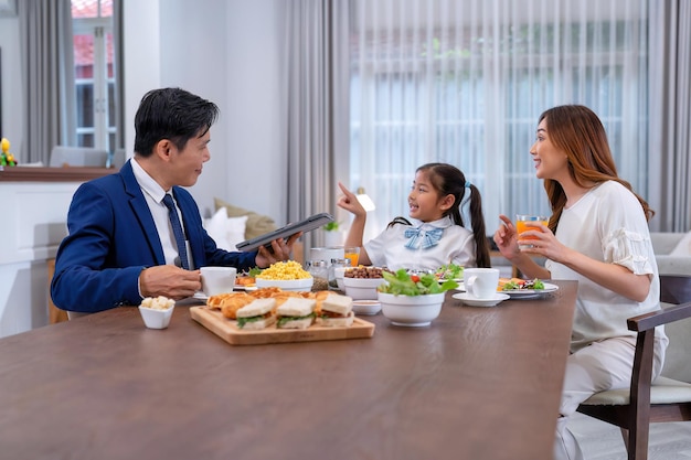 In the morning at home the family husband eating