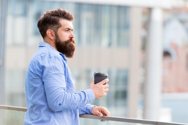 Morning inspiration. thoughtful man drink take away coffee. morning coffee. Mature hipster with beard. Bearded man relax. brutal hipster with coffee cup. energy charge. Male barber care. copy space.