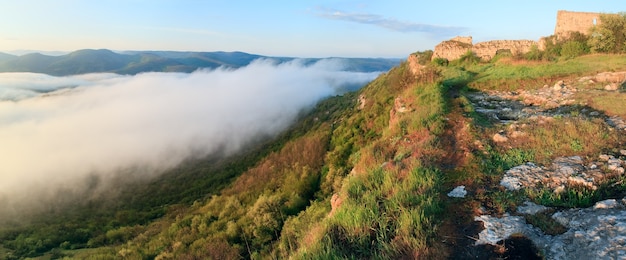 Morning panorama cloudy view from top of Mangup Kale - historic fortress and ancient cave settlement in Crimea (Ukraine). Four shots panorama image.