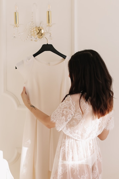 morning preparations of a bride wearing wedding dress