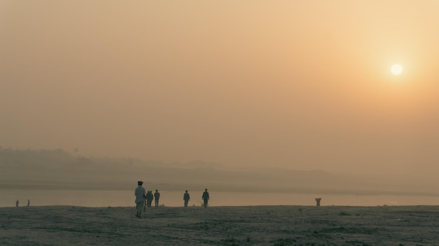 Morning on the river in Bangladesh Pedestrians are seeing the beauty of the river bank in the beautiful morning It is the GoraiMadhumati river of Bangladesh