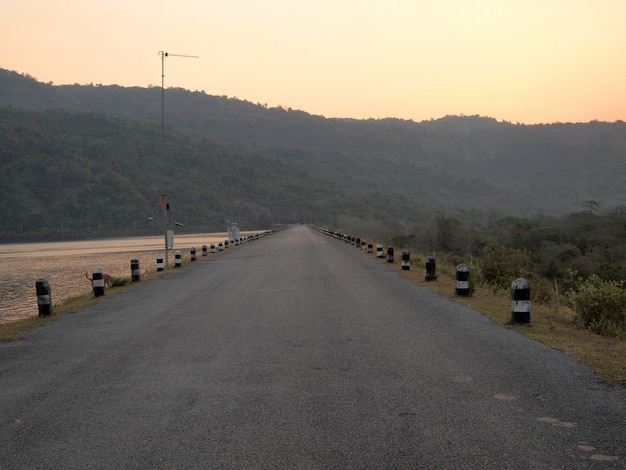 in the morning ,road on dam in Thailand