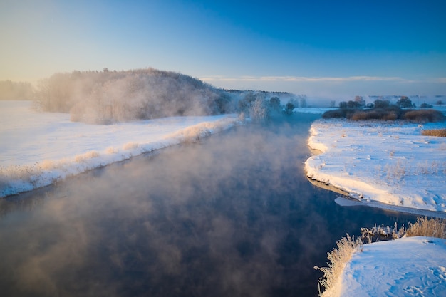 Morning sunrise on the river in winter