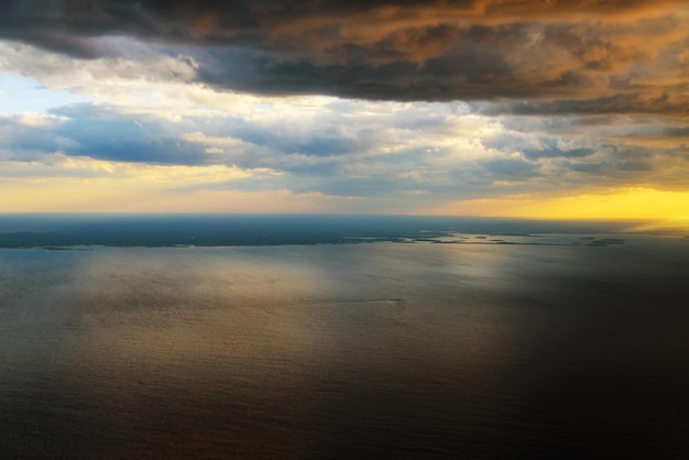 Morning sunrise view from an airplane flying over the ocean the image to add text or a website frame