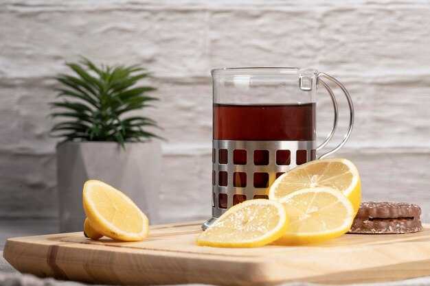 Morning tea and lemon on the table in the kitchen