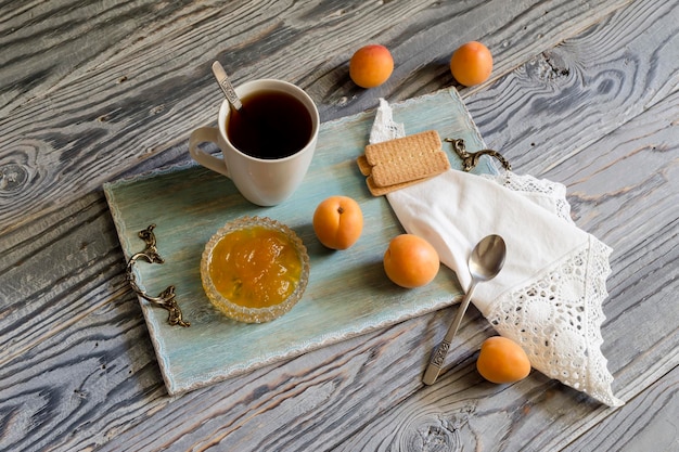 Morning tea with apricot jam closeup