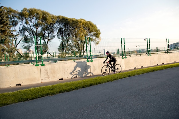 Morning urban sports landscape with cyclist