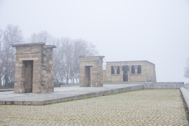 Morning view of Debod Temple in Madrid with fog