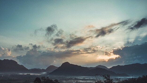 Morning view of mountain landscape with fog on sky and clouds background in Phatthalung province Southern of Thailand