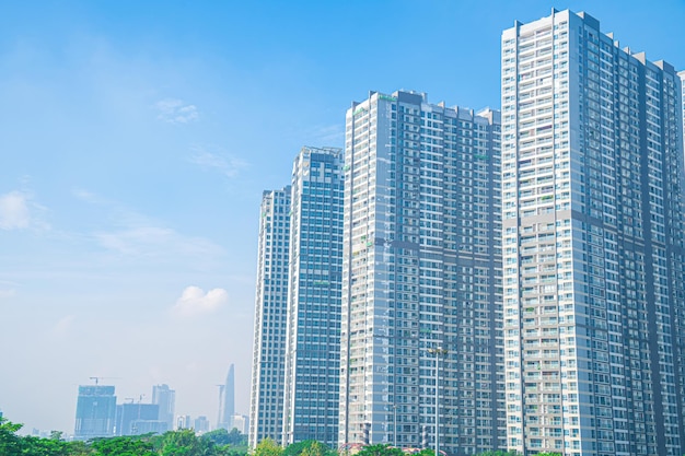 Morning view with sunny and green trees at Landmark 81 it is a super tall skyscraper with development buildings along Saigon river in Ho Chi Minh city Vietnam Business travel concept