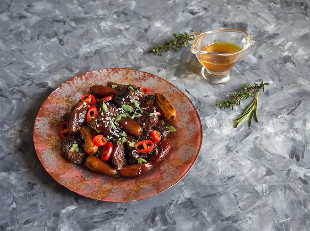 Moroccan Beef Tagine with date sauce. Crispy beef in sweet and sticky sauce.