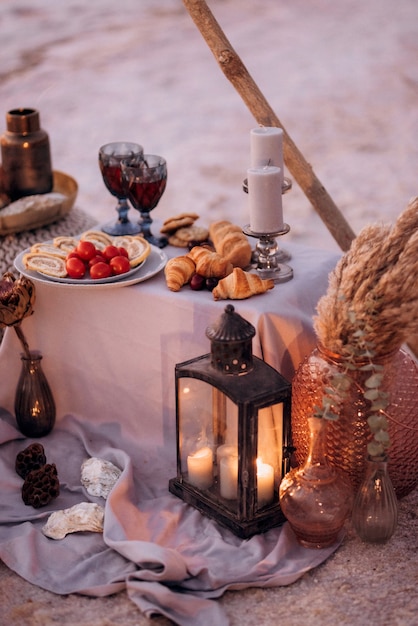 Moroccan decor on the shores of a beautiful lake, candles and bungalows