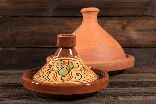 Moroccan tajines on wooden table