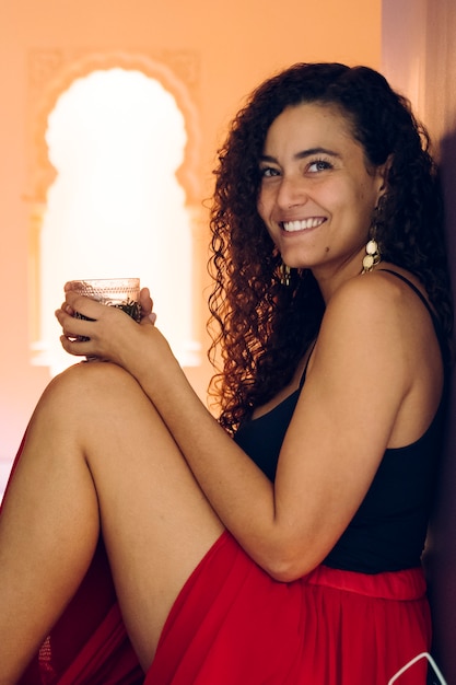 Moroccan woman preparing traditional arab tea at home